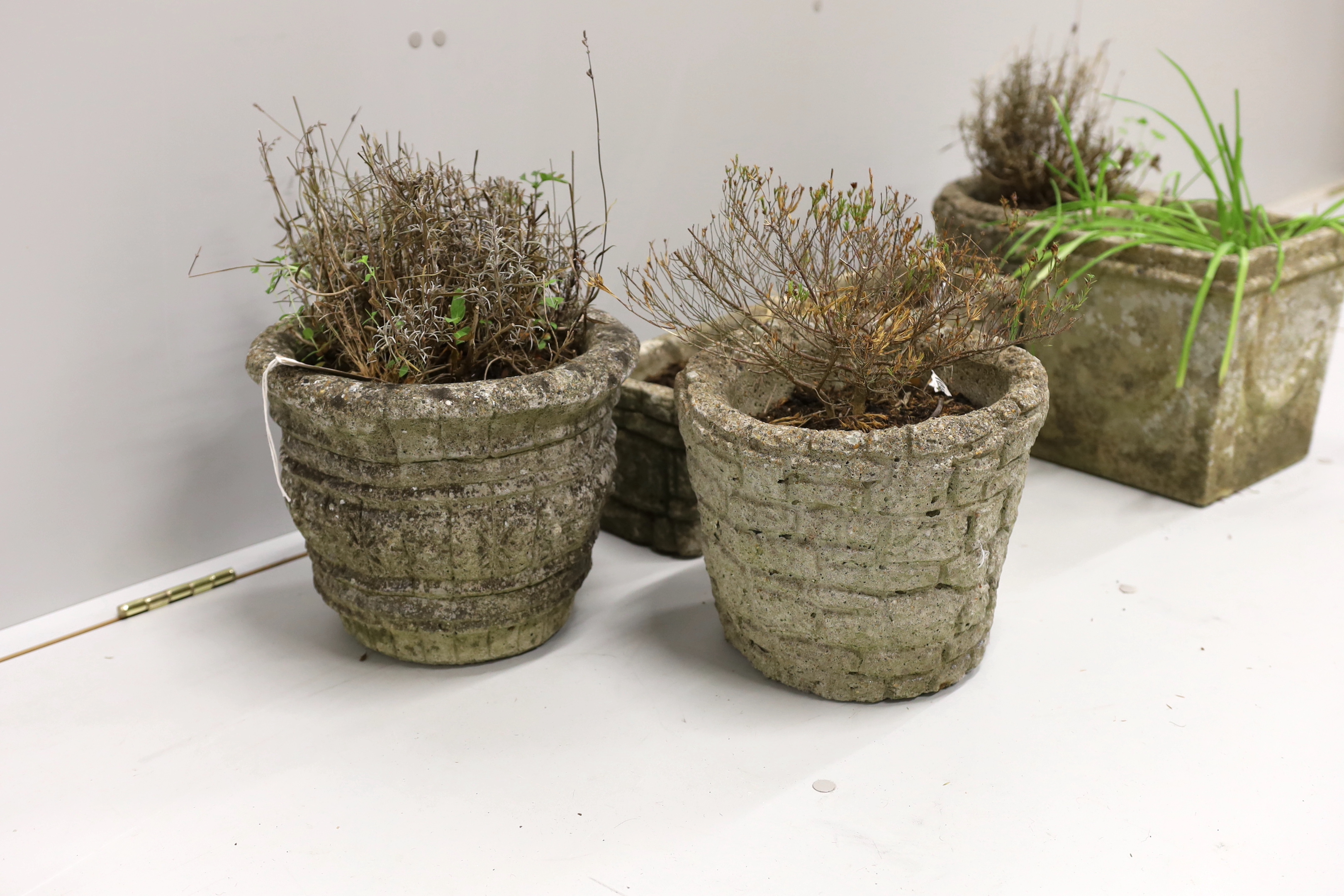 Five reconstituted stone garden planters